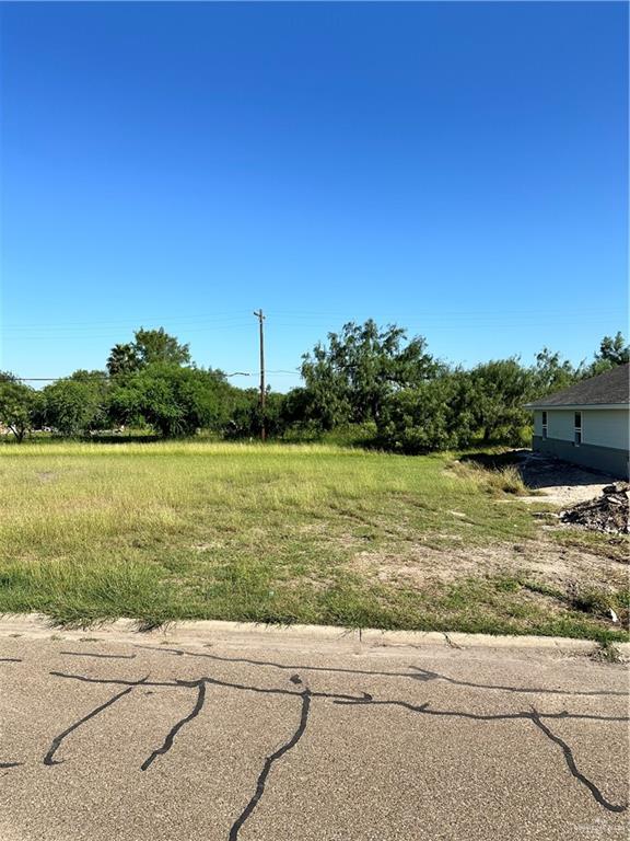 a view of lake with a yard