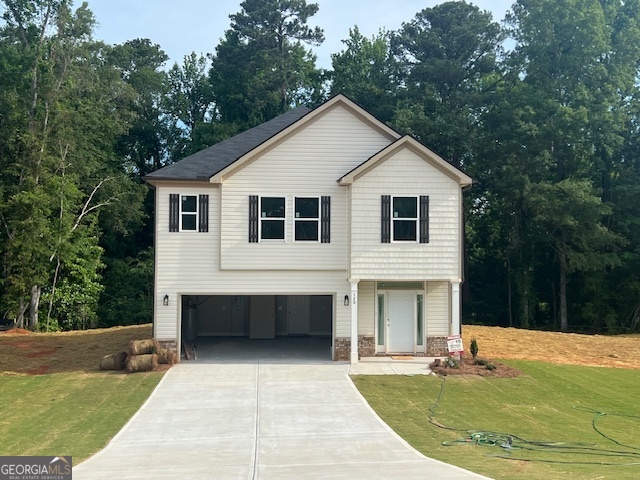 a front view of a house with a yard