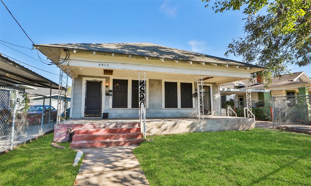 A front view of 4915 Walker.  A duplex on a 5000 sq. ft lot.