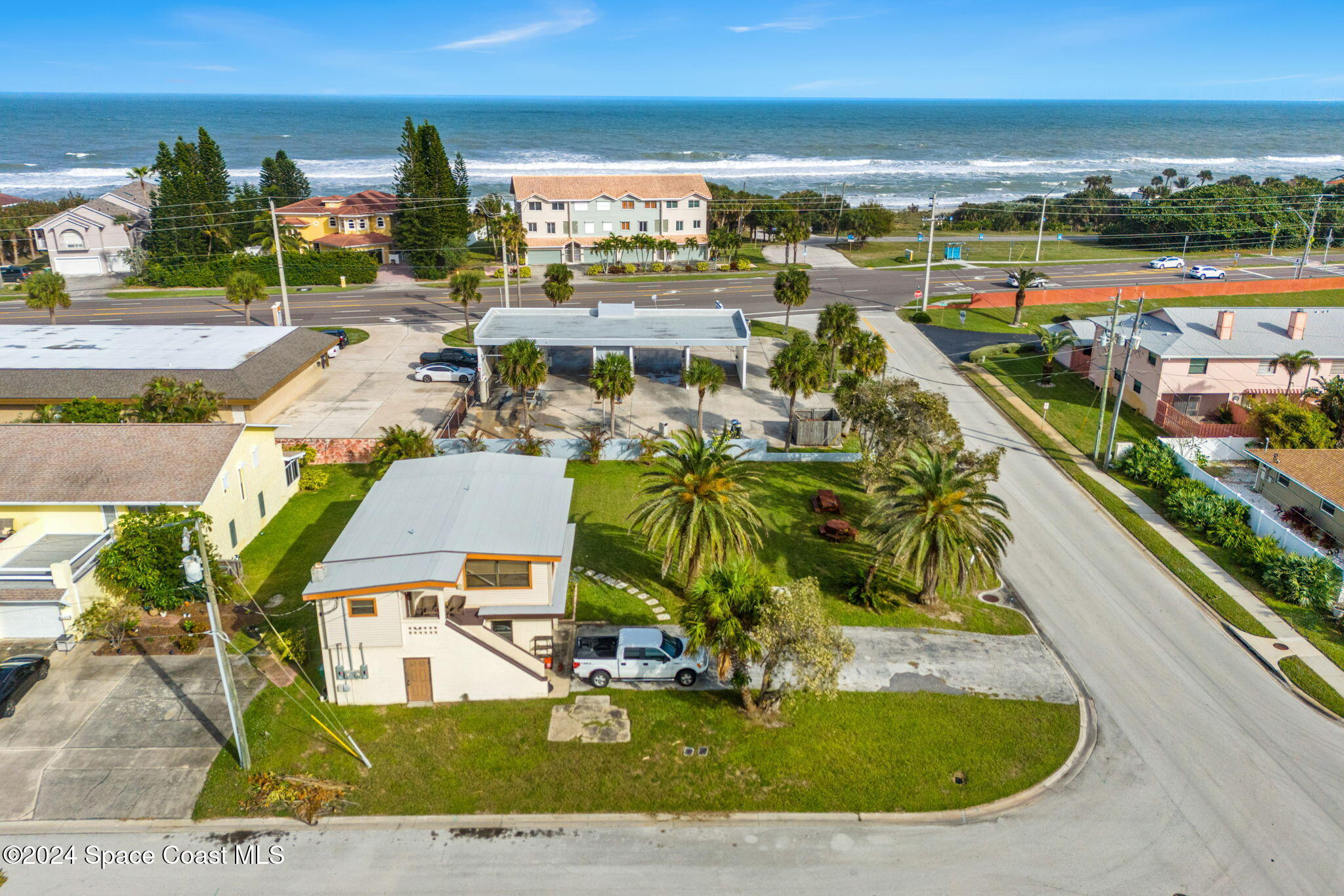 an aerial view of residential houses with outdoor space