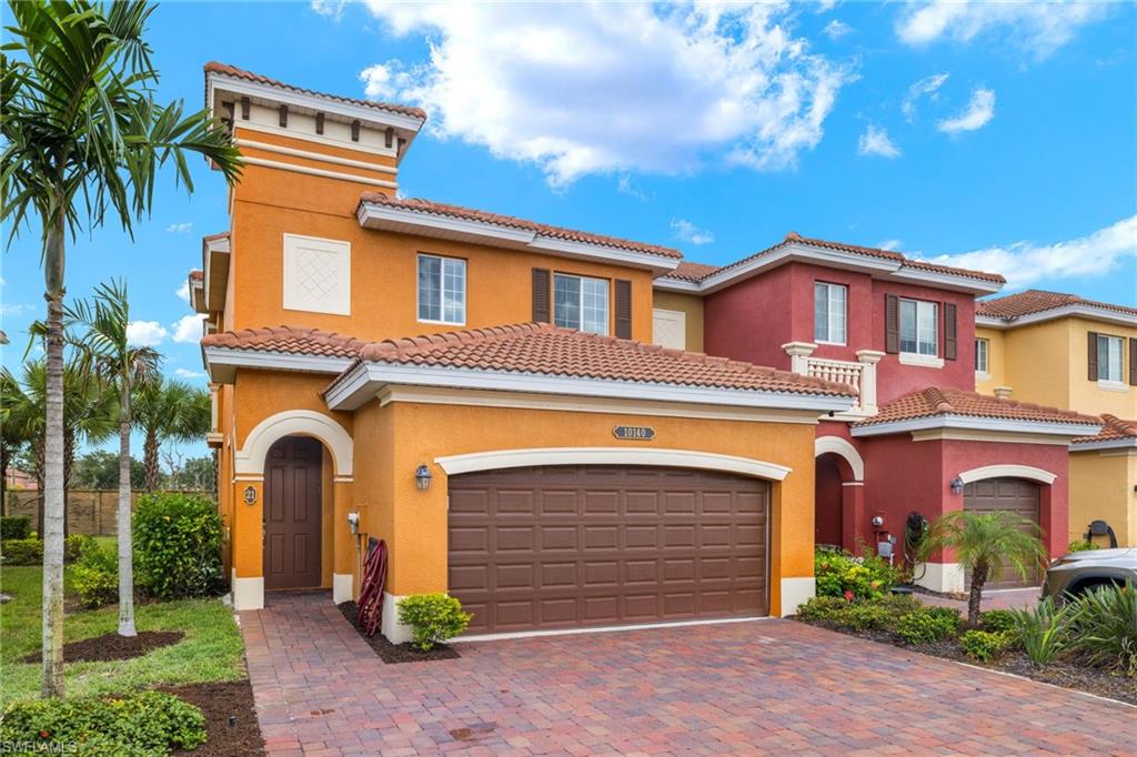 Mediterranean / spanish-style house with a garage