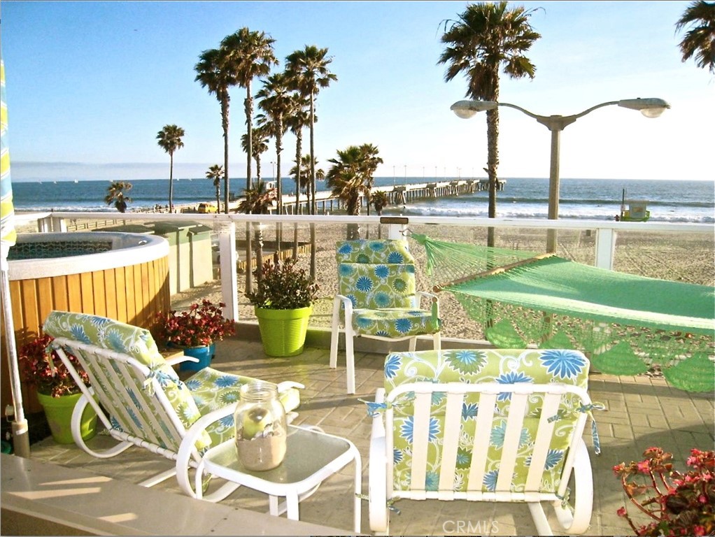 a view of swimming pool with outdoor seating