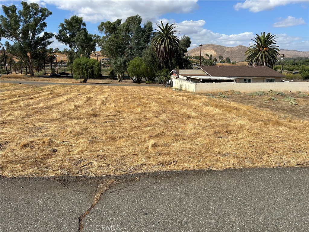 a view of white house with a yard