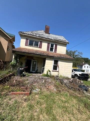 a front view of a house with parking space