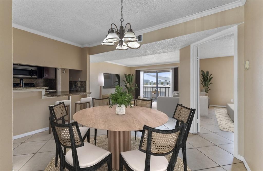 a view of a dining room with furniture and a chandelier