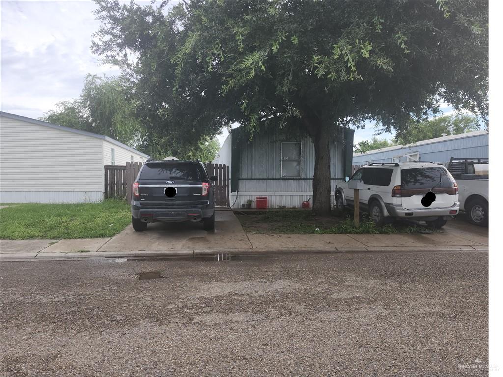 a view of a house with a back yard