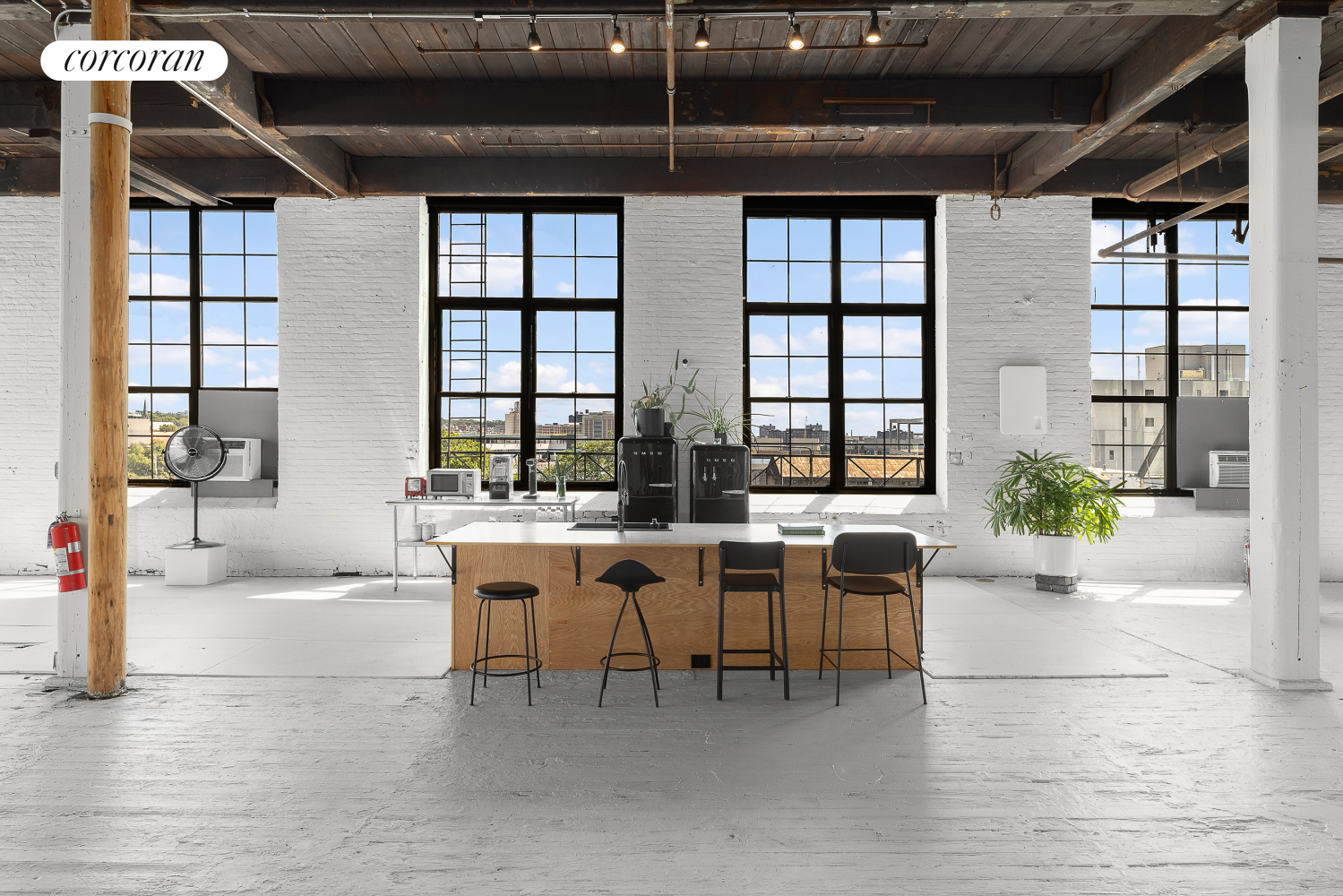 a living room with furniture a chandelier and windows