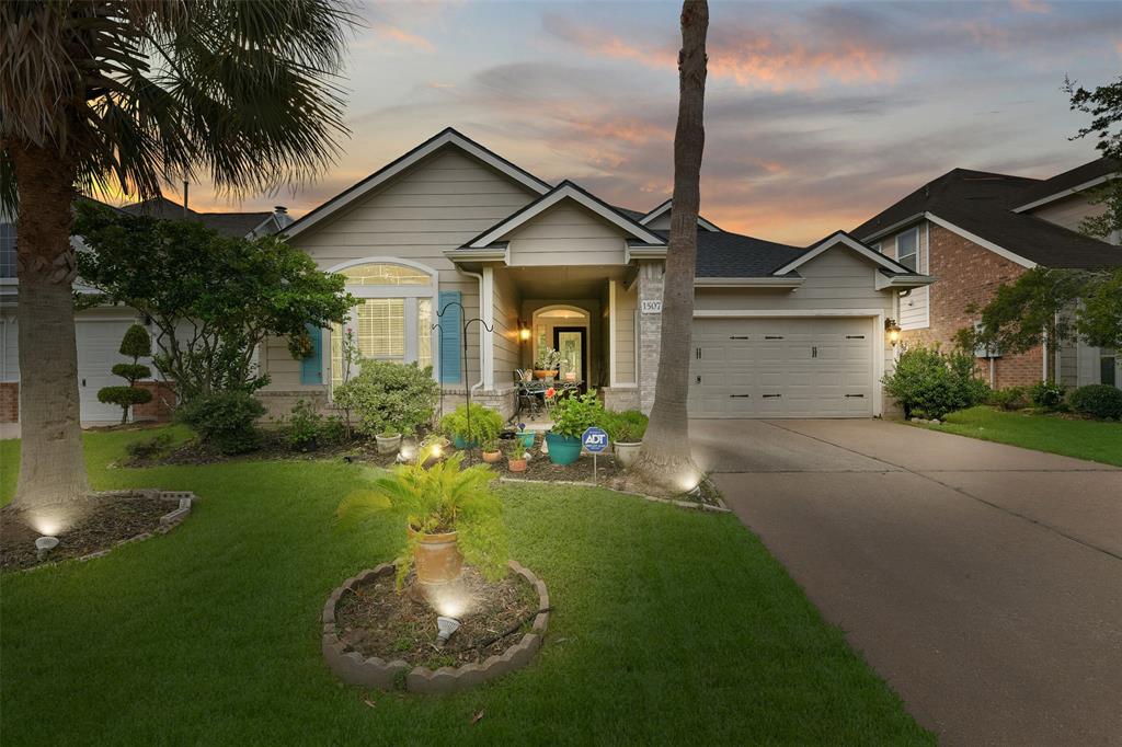 Waterfront property and access with tall Palm trees front and back yard