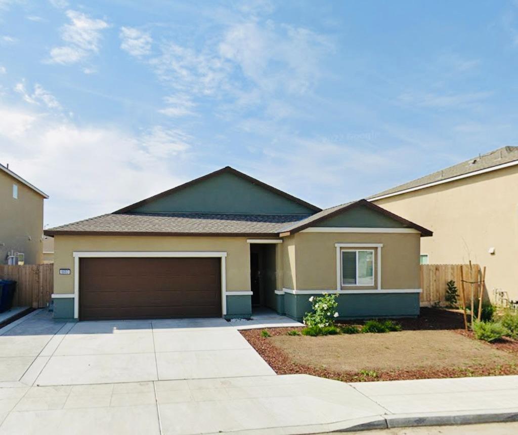 a front view of a house with yard