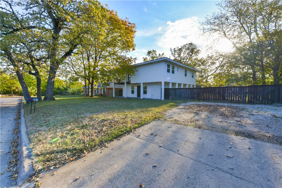 View of property exterior featuring a yard