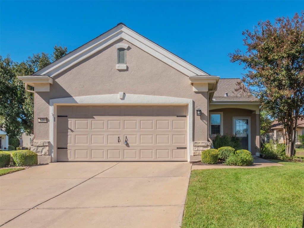 a front view of a house with a garage