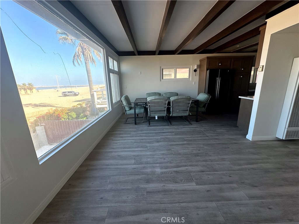 a room with wooden floor and furniture