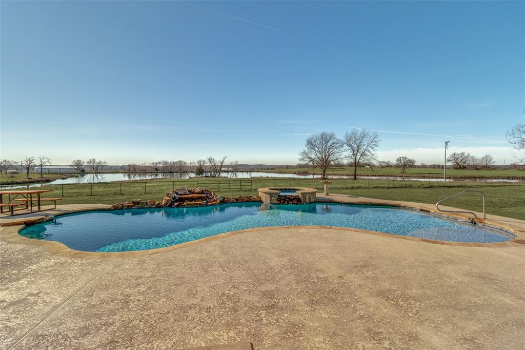 a view of a lake with a big yard