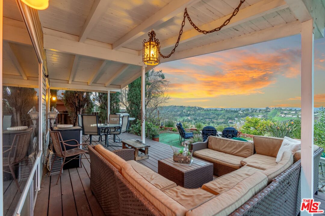 a view of a patio with couches chairs dining table and chairs