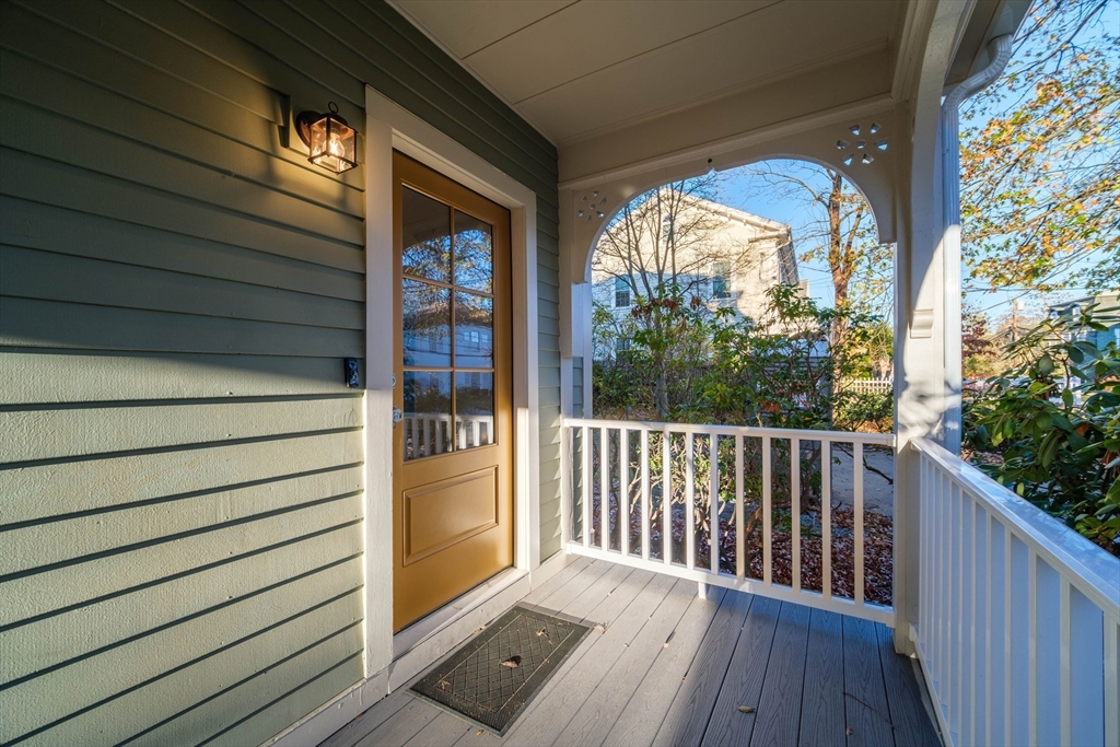 a view of a porch with wooden floor and outdoor space