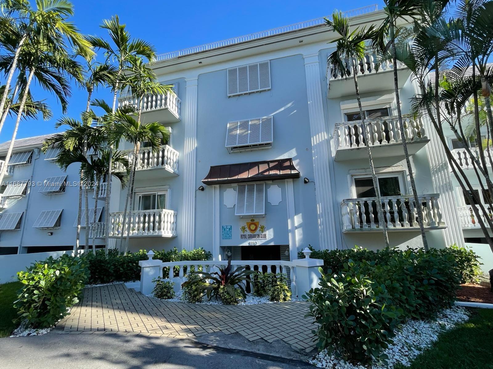 a front view of a building with garden