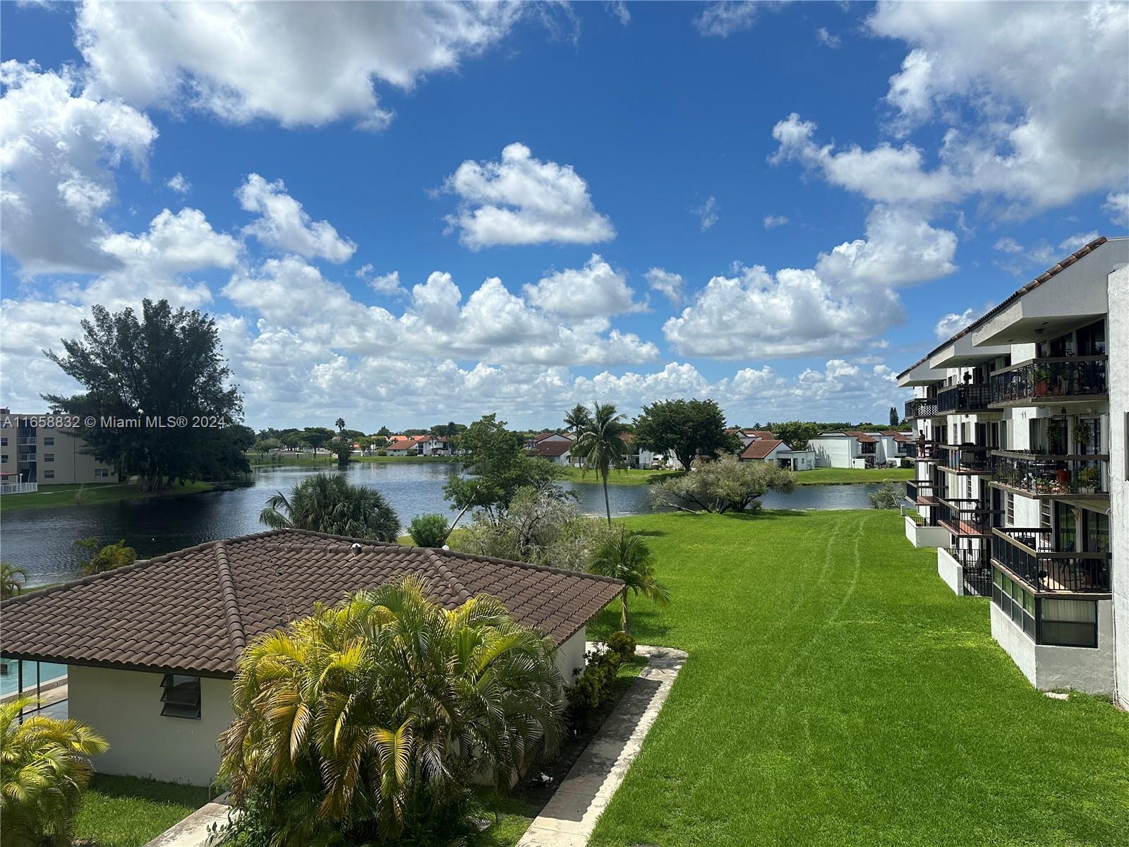 a view of a lake in front of the house