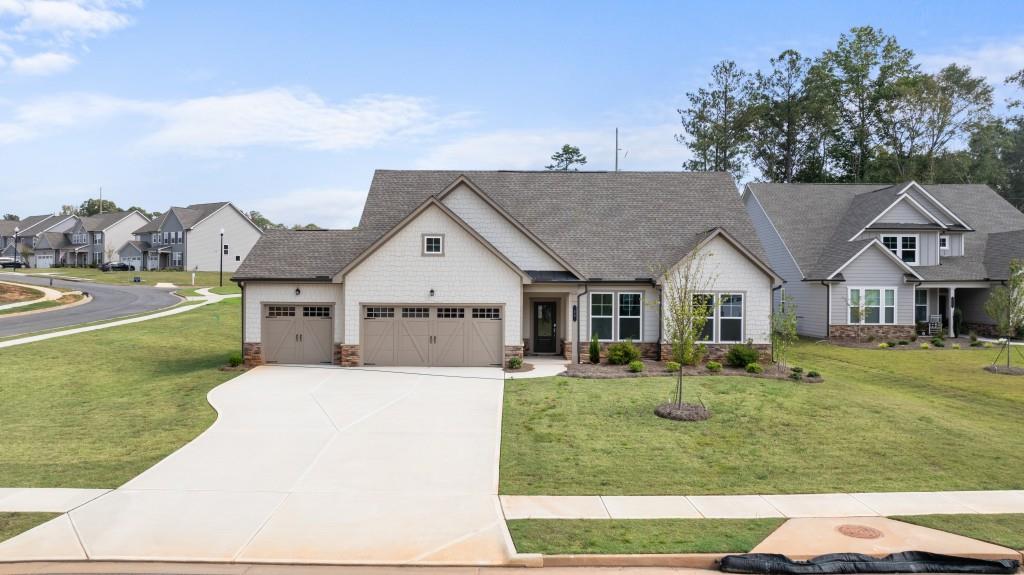 a front view of a house with a yard