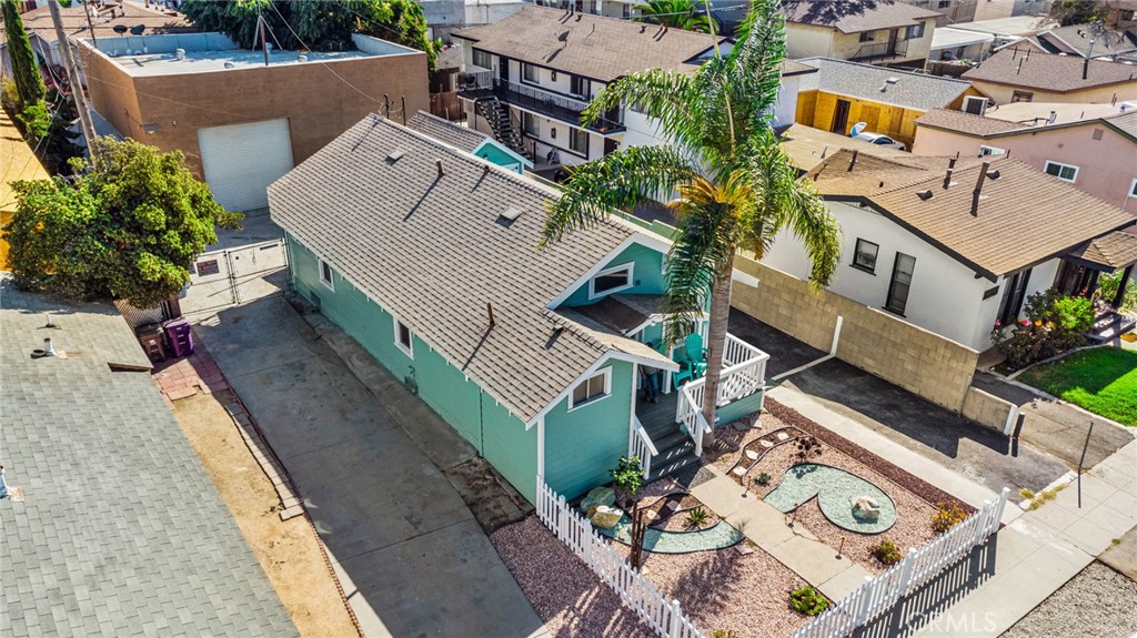 an aerial view of a house with roof deck and balcony