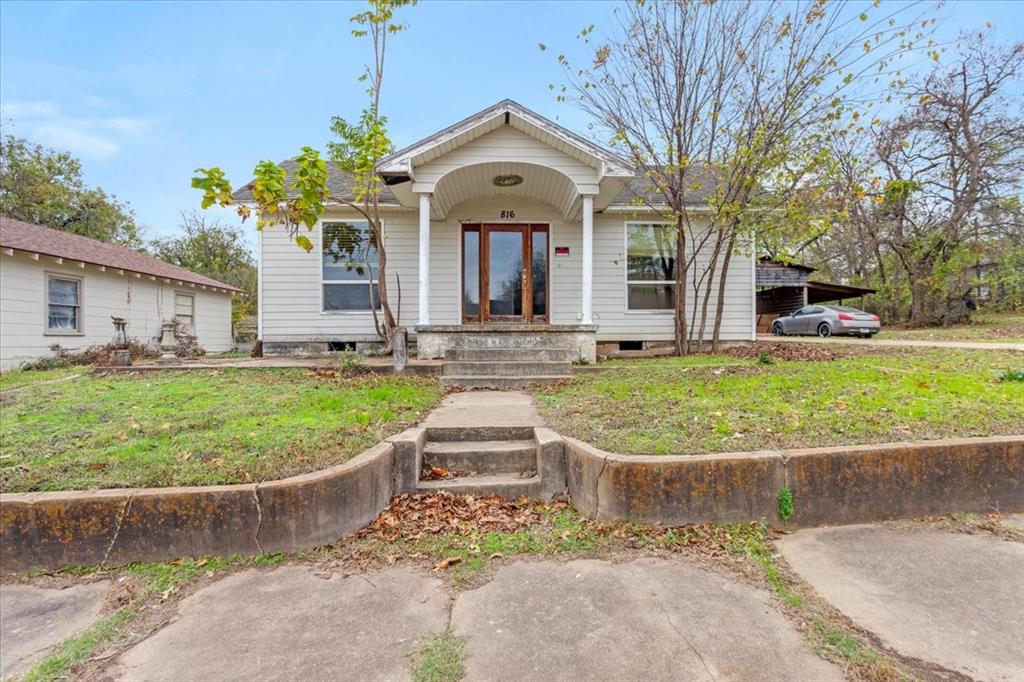 front view of a house with a yard