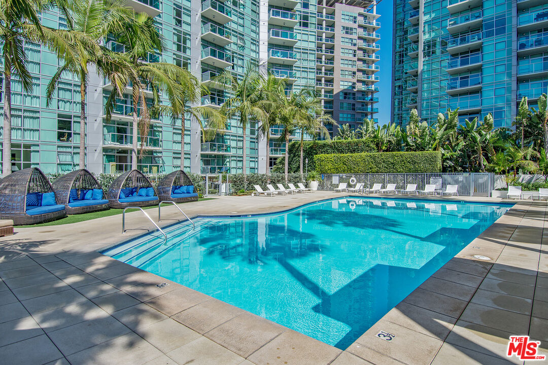 a view of swimming pool with outdoor seating