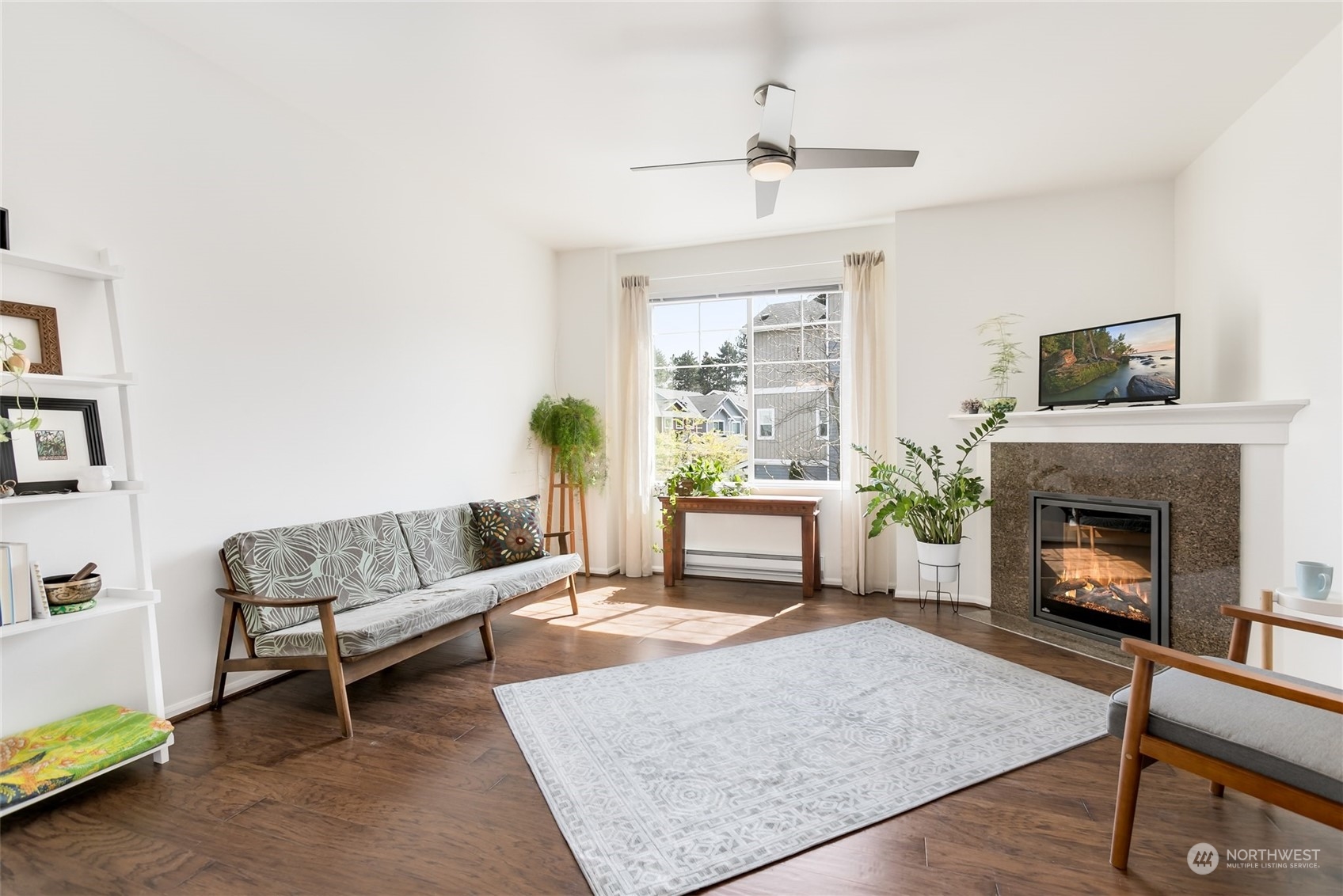 a living room with furniture and a fireplace