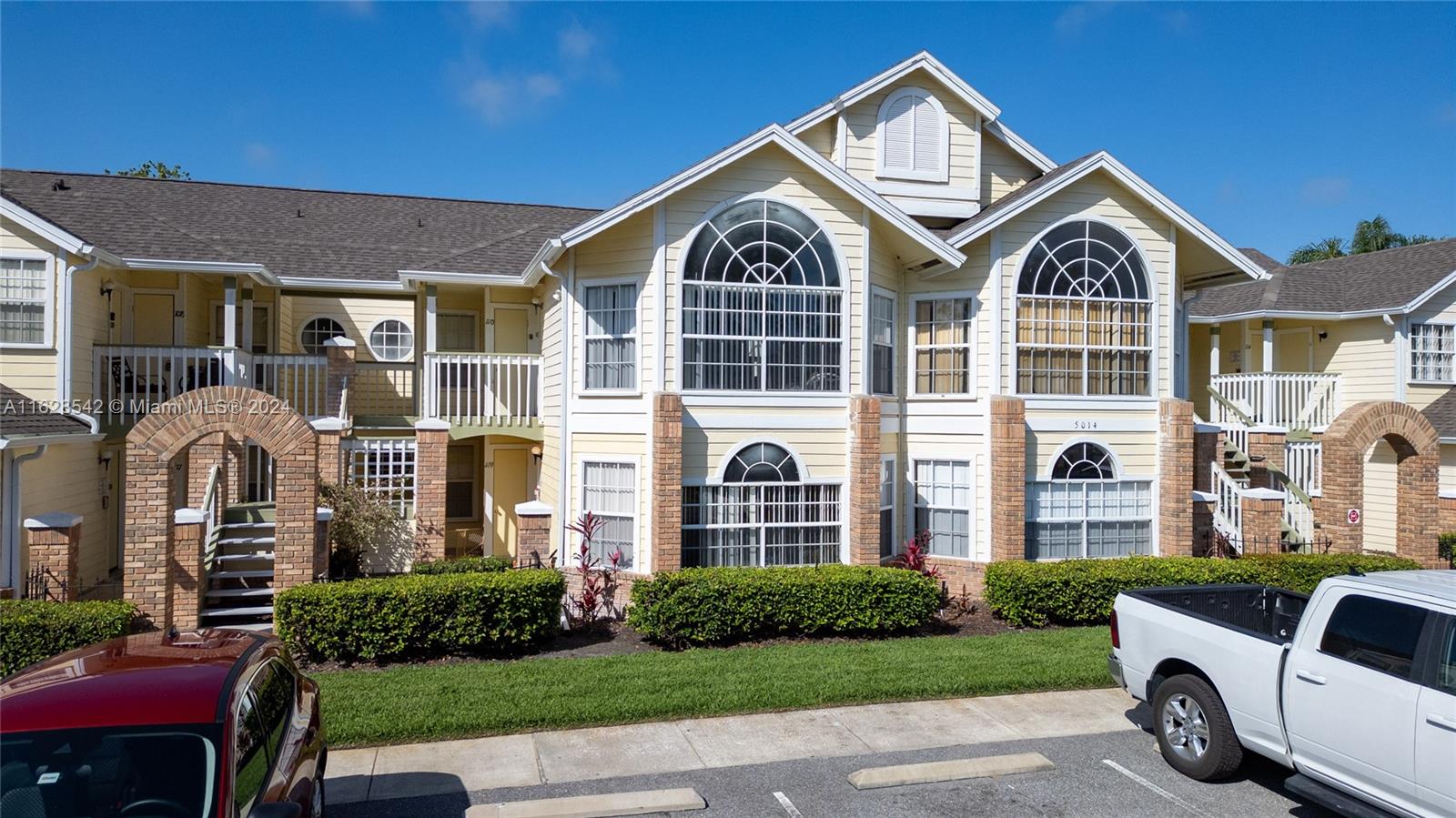 a front view of a house with a yard