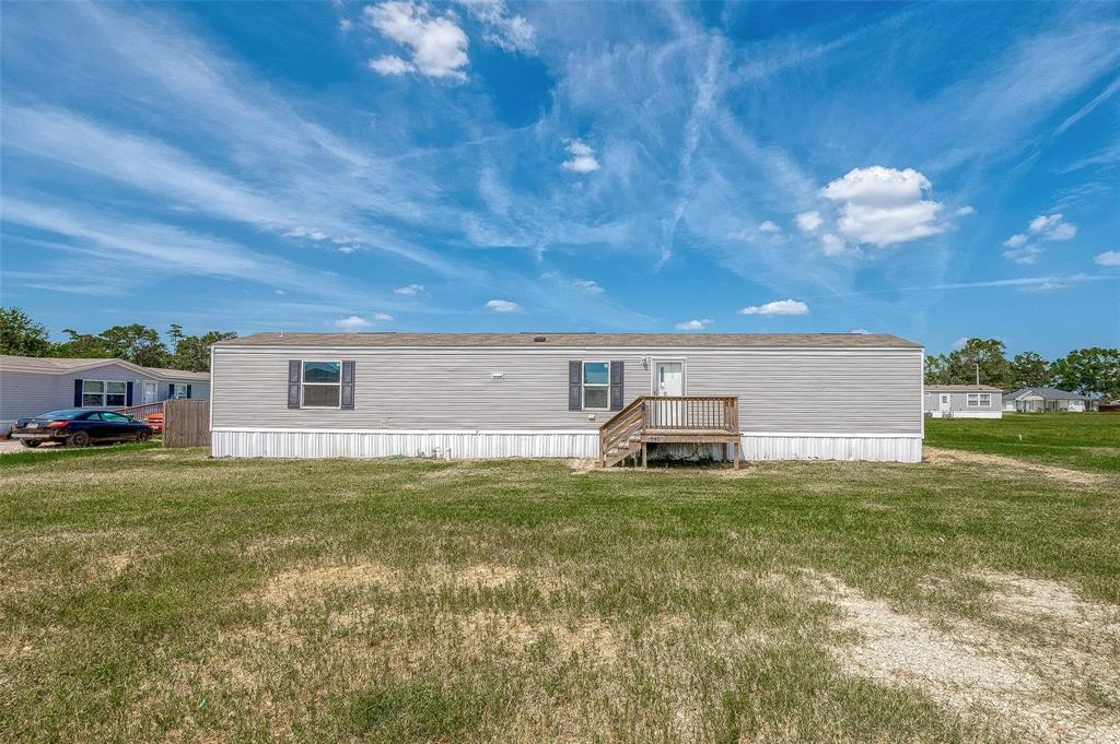 a view of a house with a back yard