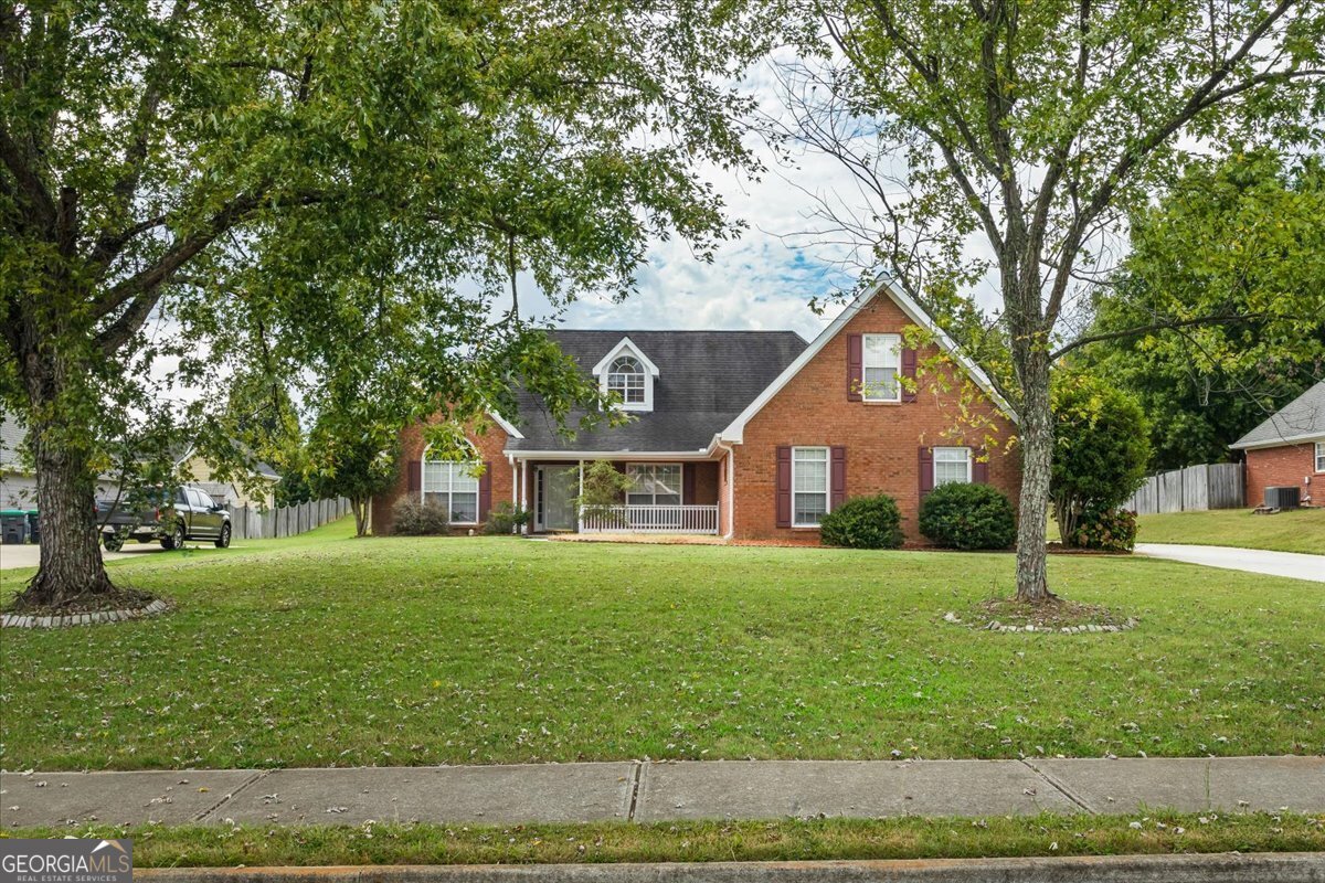 a front view of a house with a yard