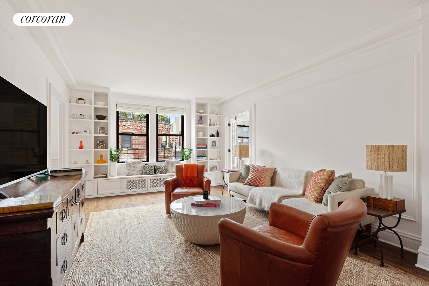 a living room with furniture and a flat screen tv