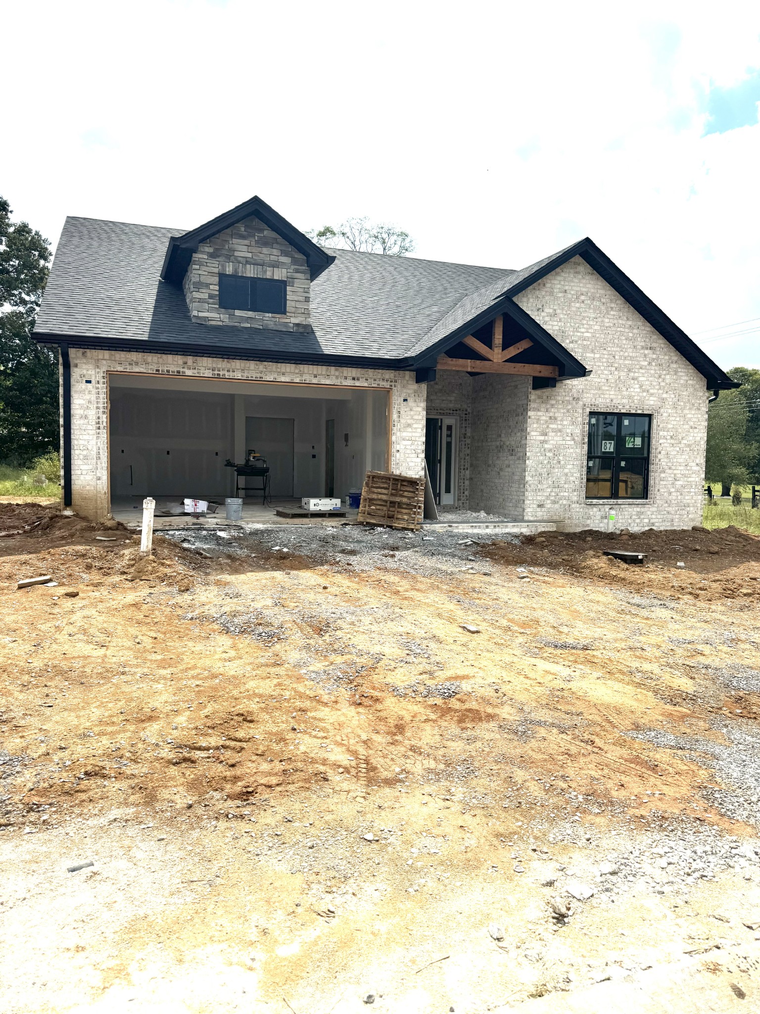 a front view of a house with yard