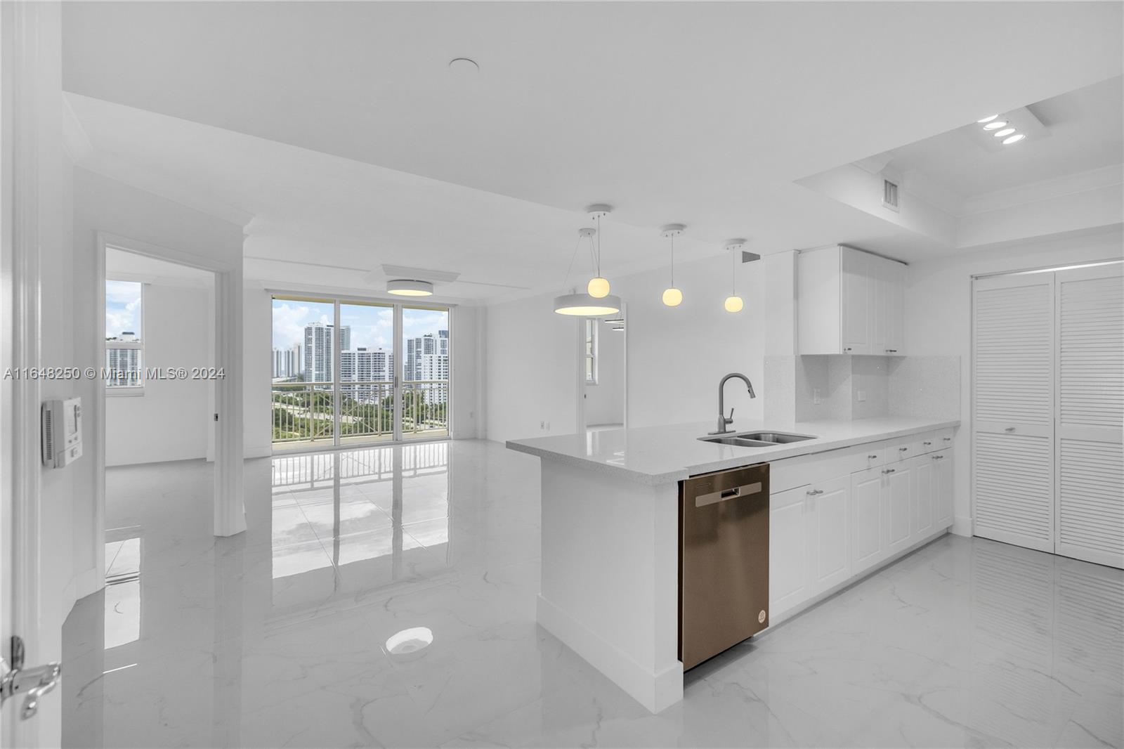 a kitchen with a sink and refrigerator