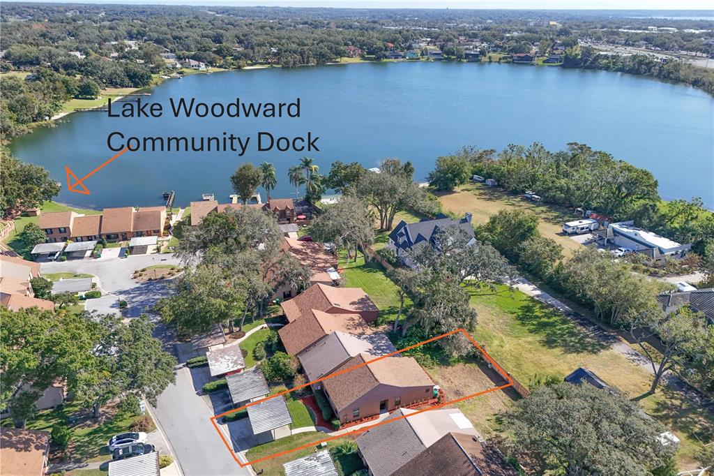 an aerial view of a house with a lake view