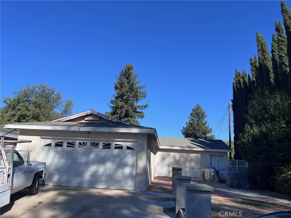 a view of house with outdoor space