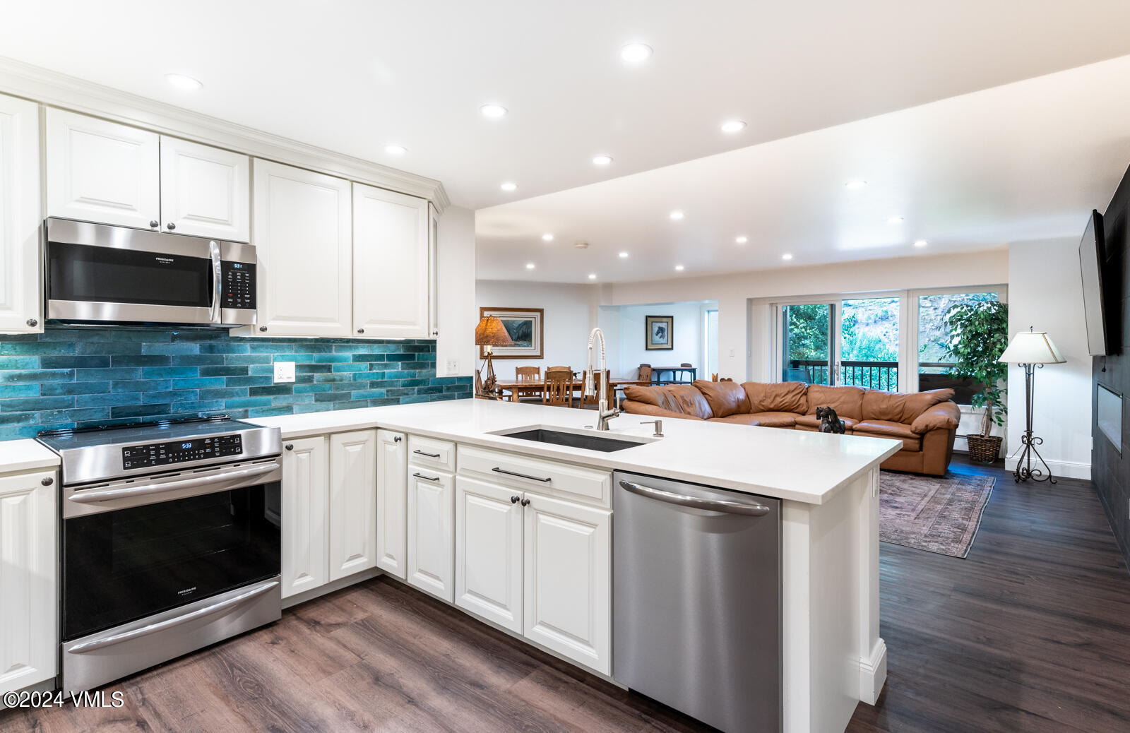 a kitchen with counter top space and appliances