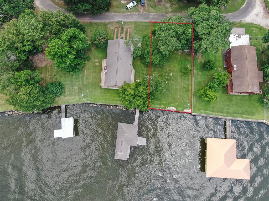 an aerial view of a house with outdoor space