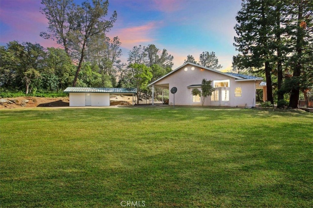 a view of a house with a big yard