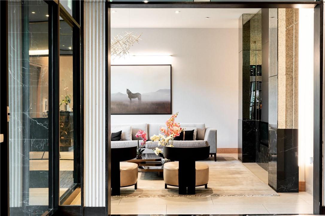 a living room with furniture and a mirror