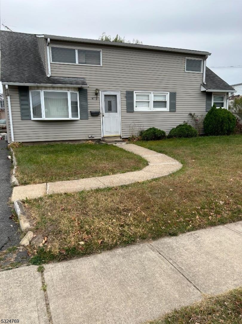 a view of outdoor space yard and front view of house