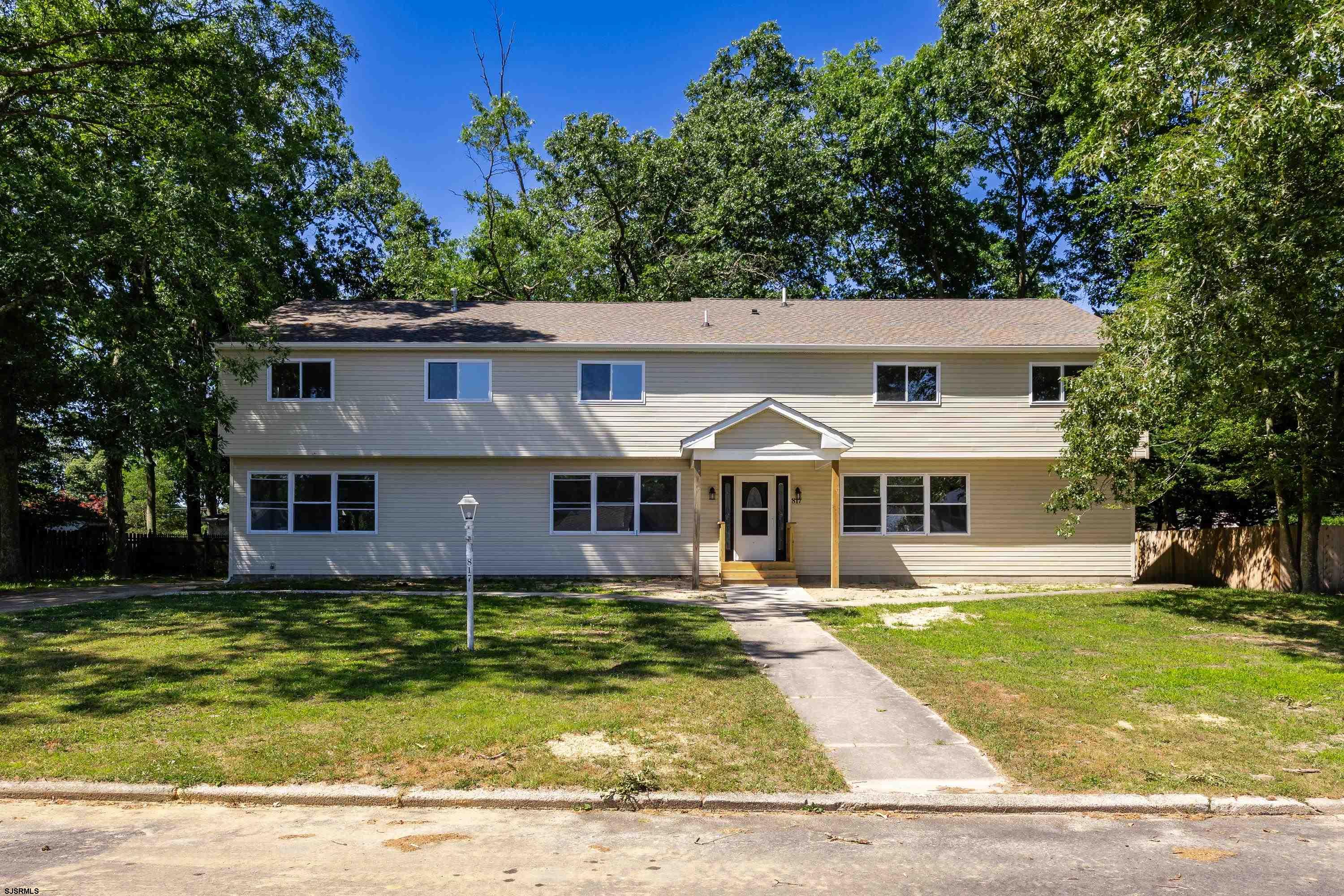 front view of a house with a yard