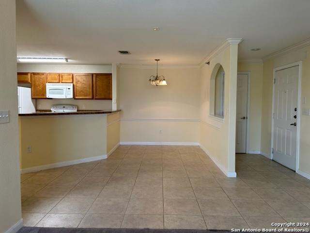 a view of a kitchen cabinets and a counter place