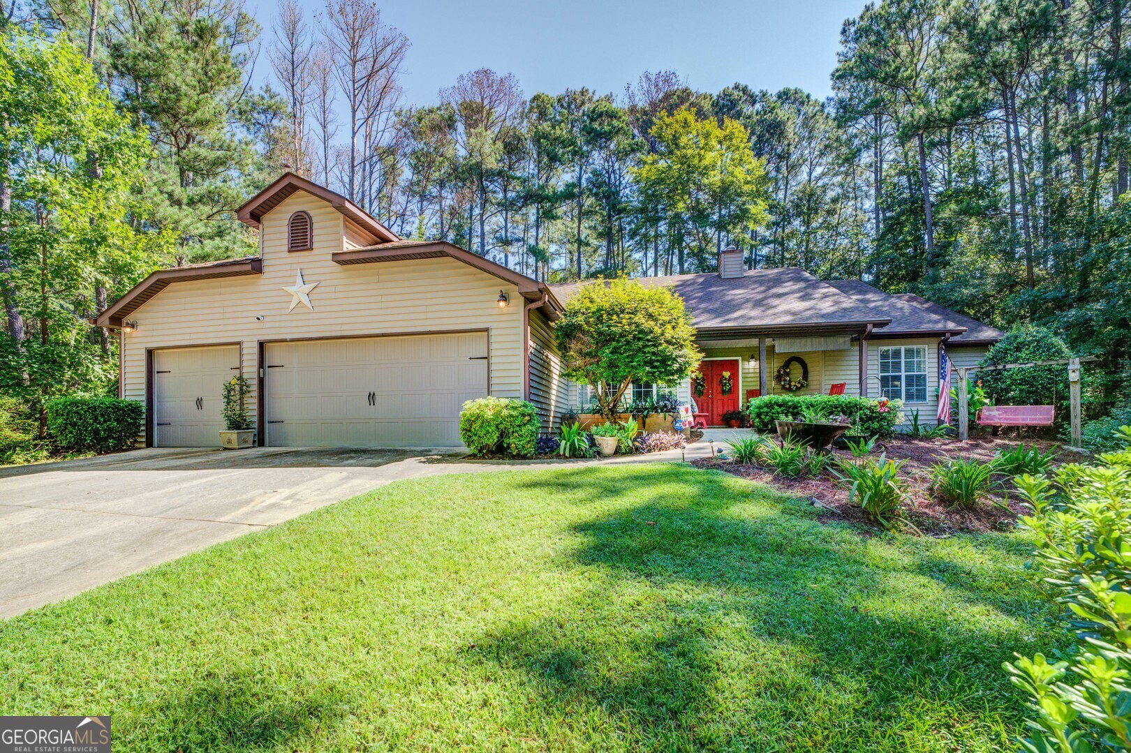 a front view of a house with garden