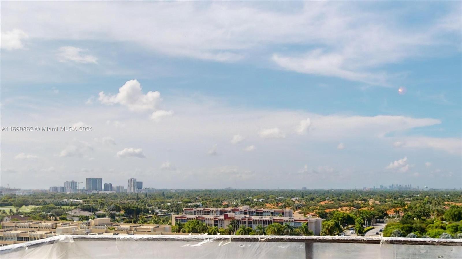 a view of a city with lots of buildings in the background