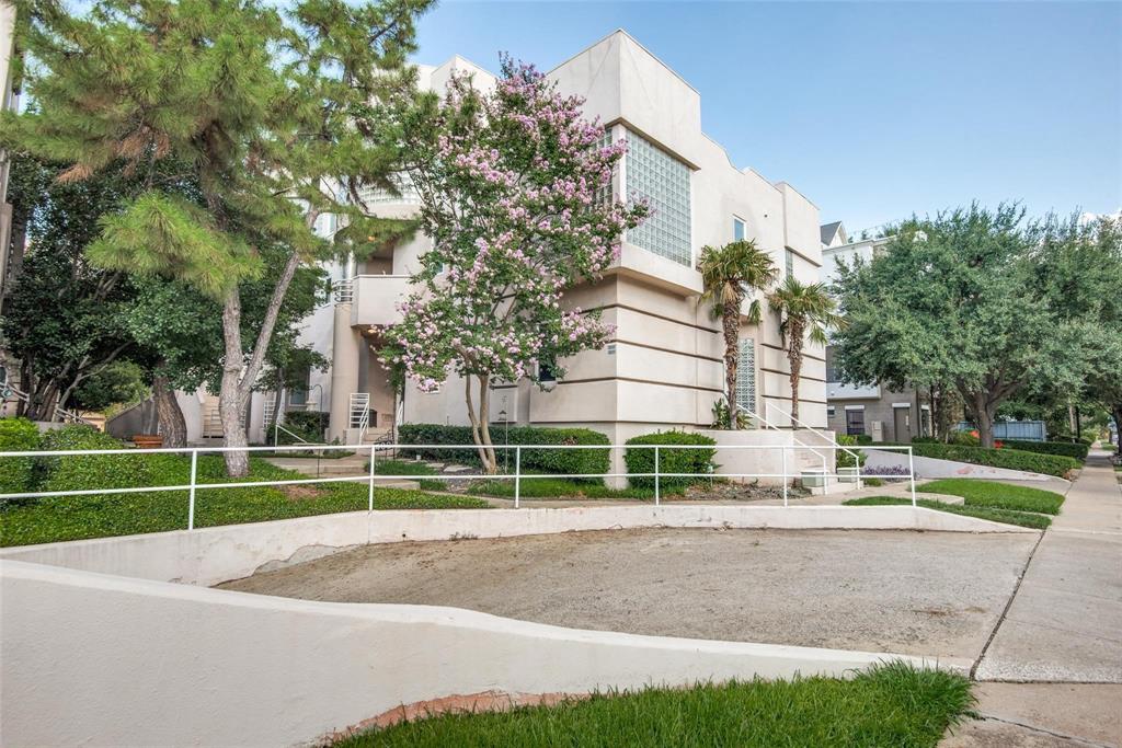 a view of a house with a big yard and plants