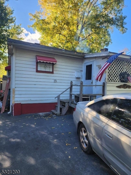 a front view of a house with parking space