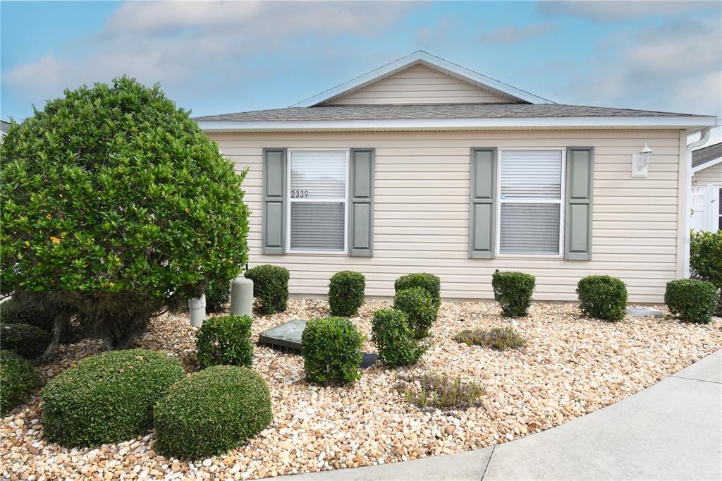 front view of a house with a yard