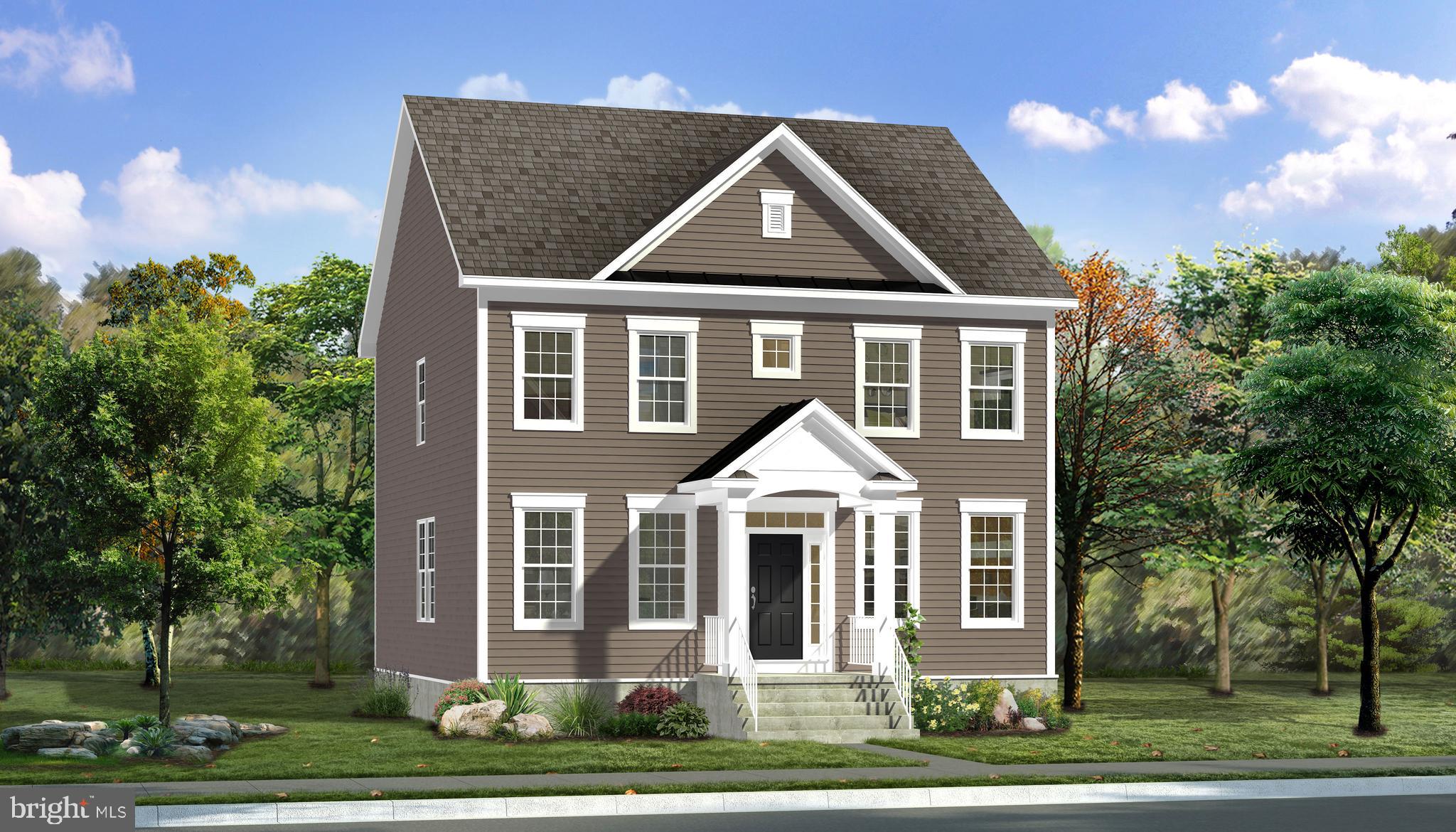 a front view of a residential houses with yard