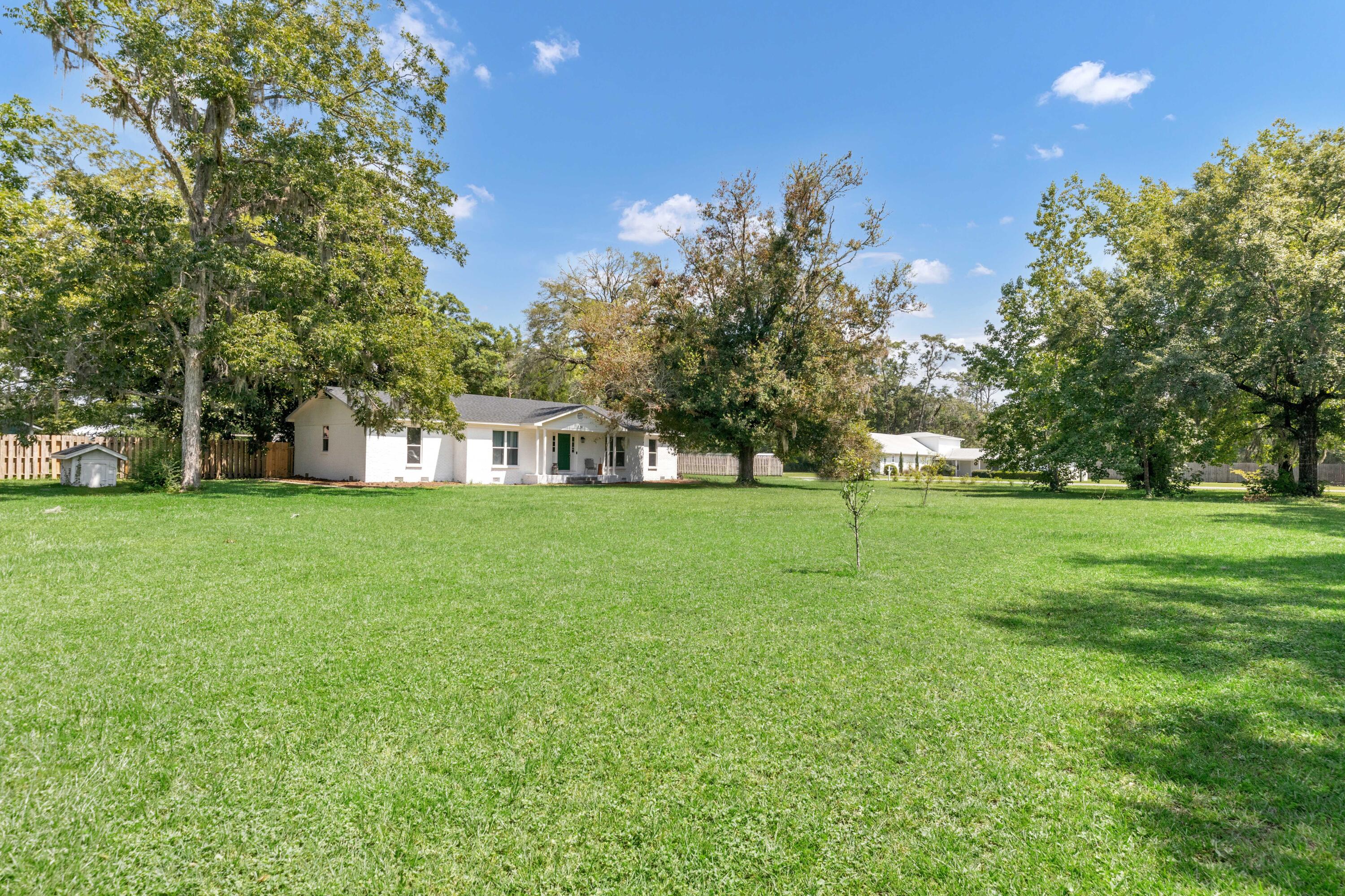 a view of a house with a big yard