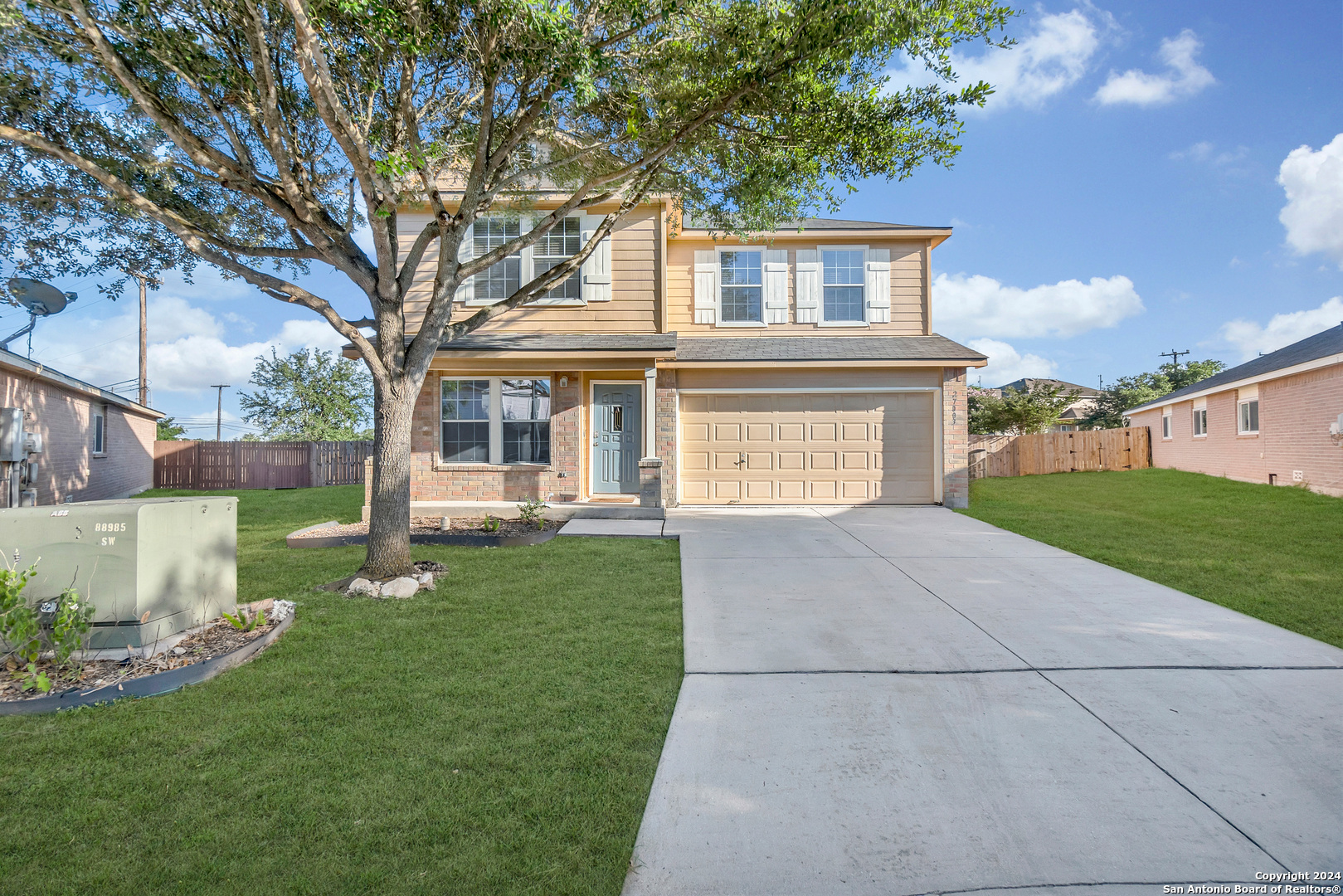 front view of a house with a yard