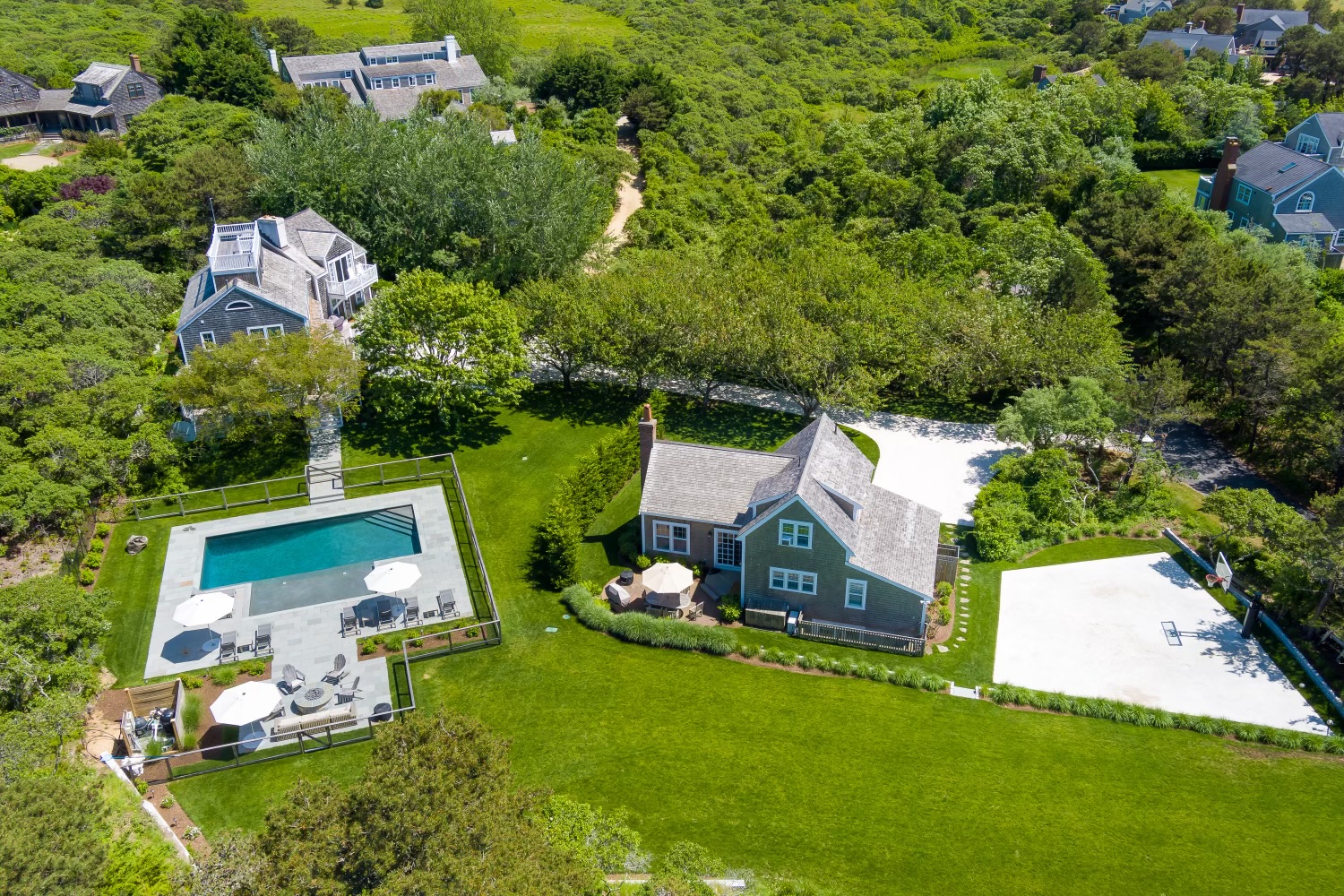 an aerial view of a house with a garden